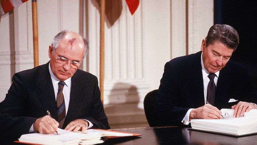 Ronald Reagan and Mikhail Gorbachev signing the Intermediate Range Nuclear Forces Treaty in 1987