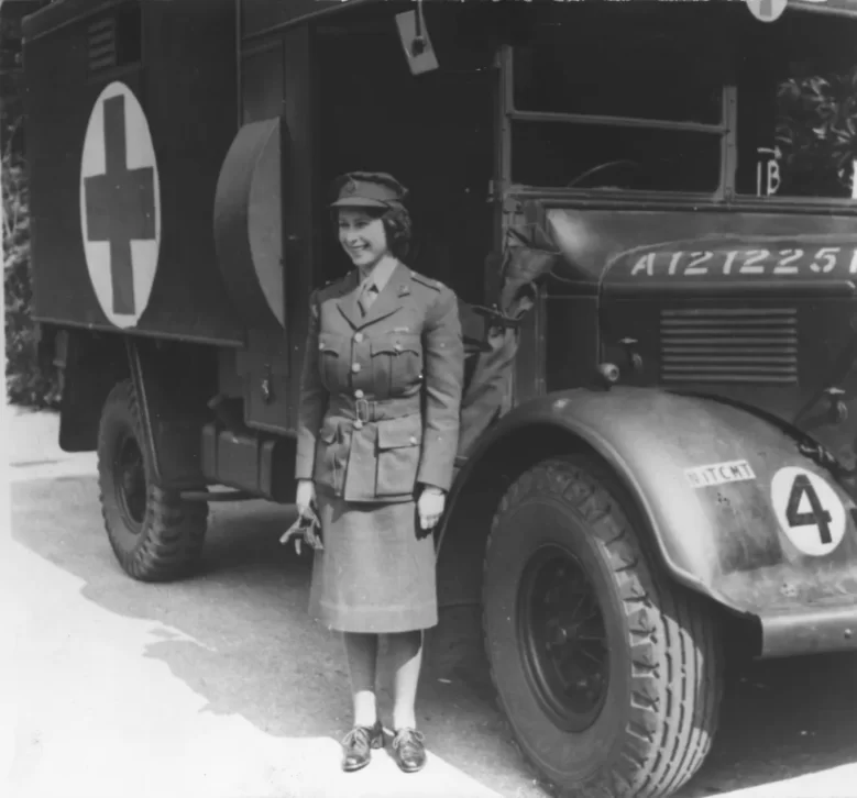 Princess Elizabeth standing by an Auxiliary Territorial Service first aid truck wearing an officers uniform in 1945